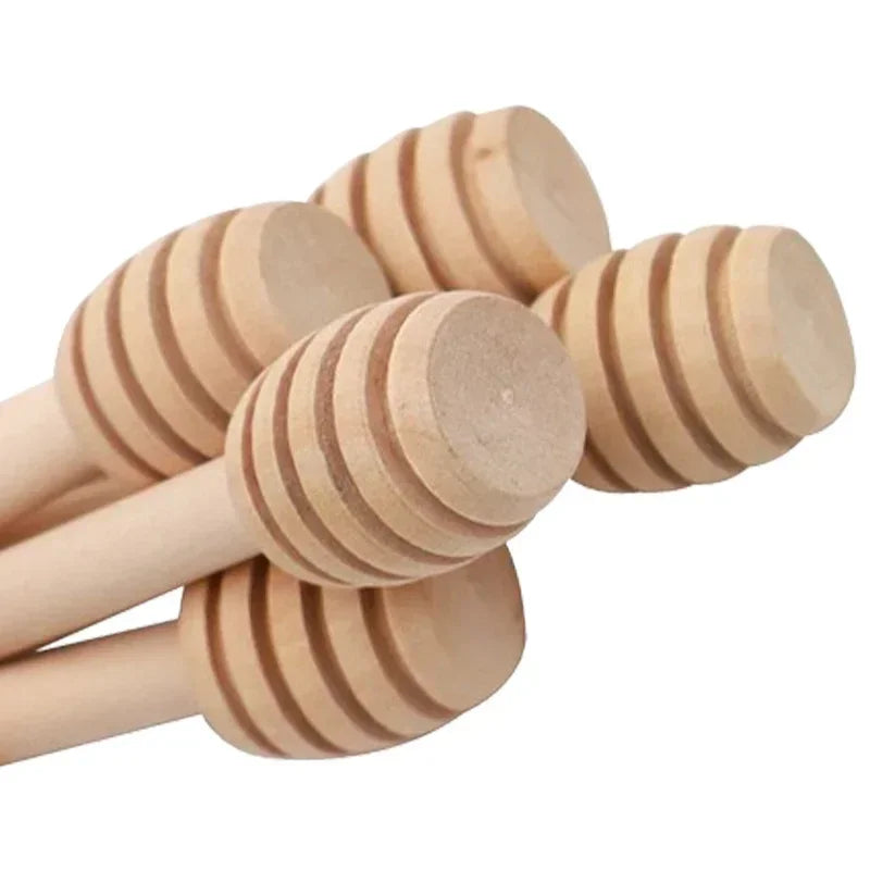 A set of ten natural wood honey dipper sticks with ribbed ends.