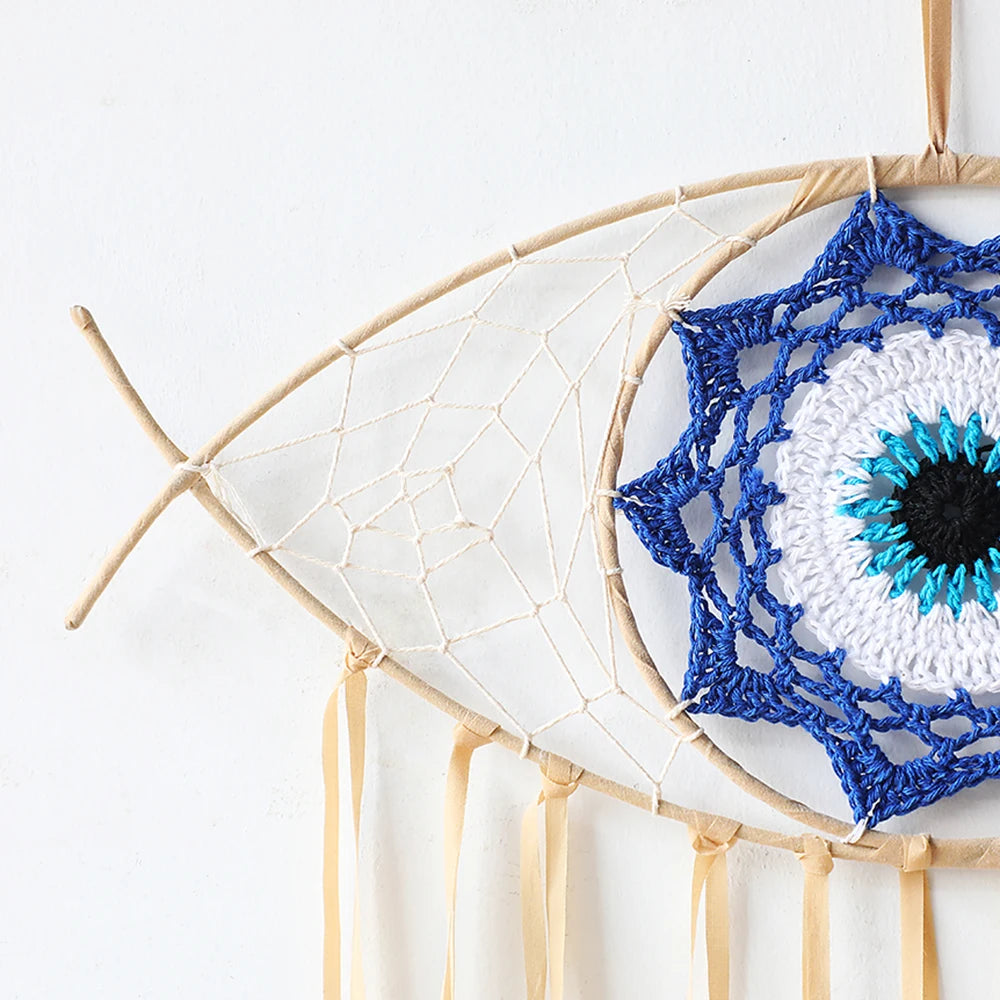 Handmade boho evil eye dream catcher wall decor featuring a white and blue geometric design