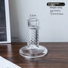 A clear glass pillar candle holder with a diamond pattern, shown standing on a round base.