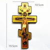 A handcrafted wooden Orthodox cross wall decor with detailed carvings and inscriptions.