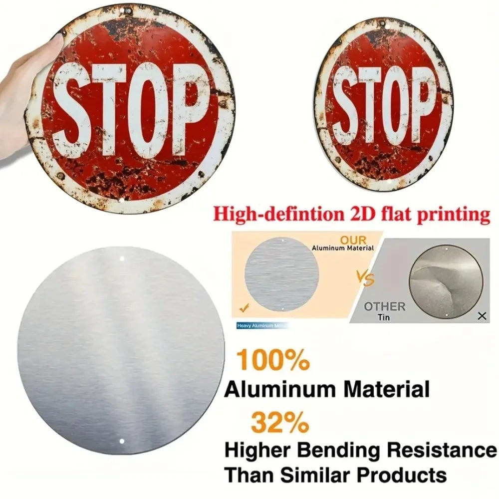 A vintage metal round stop sign with the word STOP in white lettering, shown next to a polished aluminum plate.