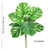 Artificial Monstera plant with eight silk green leaves shown against a white background.