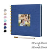 A blue linen cover scrapbook album with a photo insert and a wooden ruler.