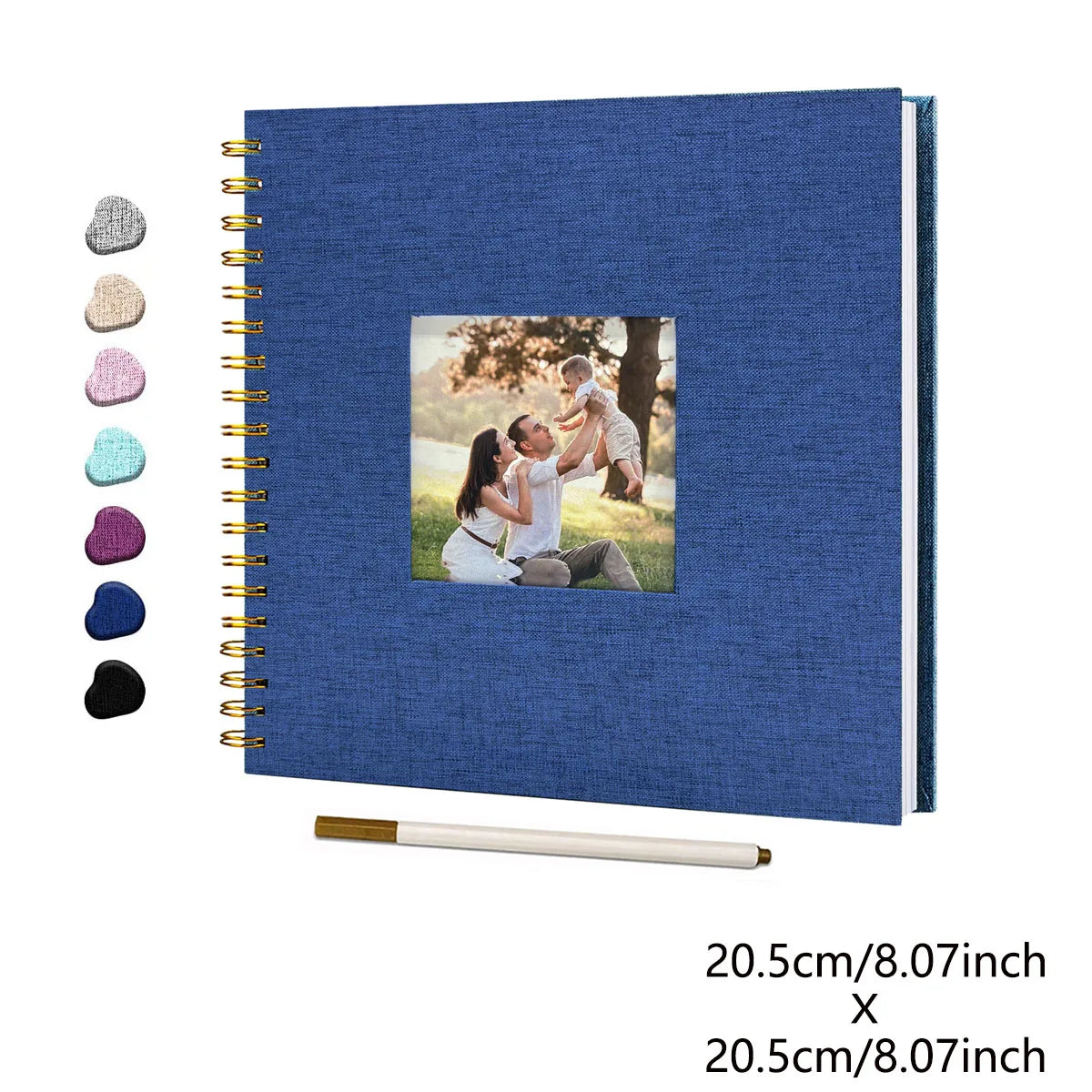 A blue linen cover scrapbook album with a photo insert and a wooden ruler.