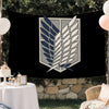 A decorative banner featuring a crest design with stylized wings in blue and gray on a black background.