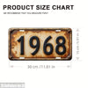 A vintage brass-colored aluminum license plate tag with the year 1968 embossed on it.