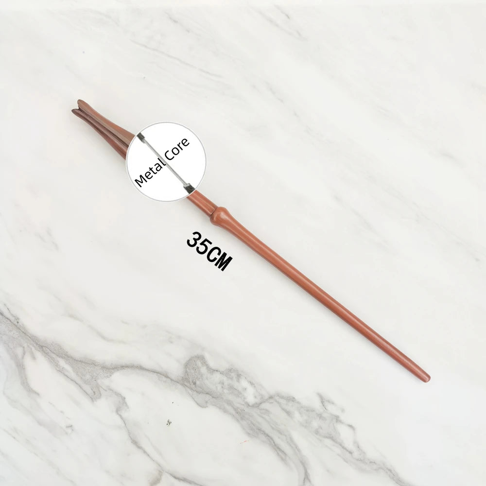 A brown metal magic wand replica with a metal core shown against a white marble background.