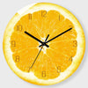 A round clock face designed like a sliced orange, showing the time.
