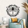 Elegant black dragonfly metal wall art silhouette displayed above a light blue armchair.