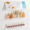 Clear acrylic floating record shelves displaying various cosmetic bottles and tubes.