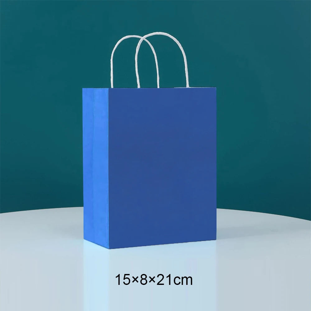 A solid blue paper food tray with white handles against a teal background.