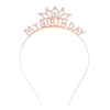 A delicate rose gold tiara crown headband for women and girls with sparkling stones.