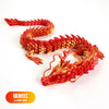 A detailed resin figurine of a conjoined dragon ornament in laser red color.