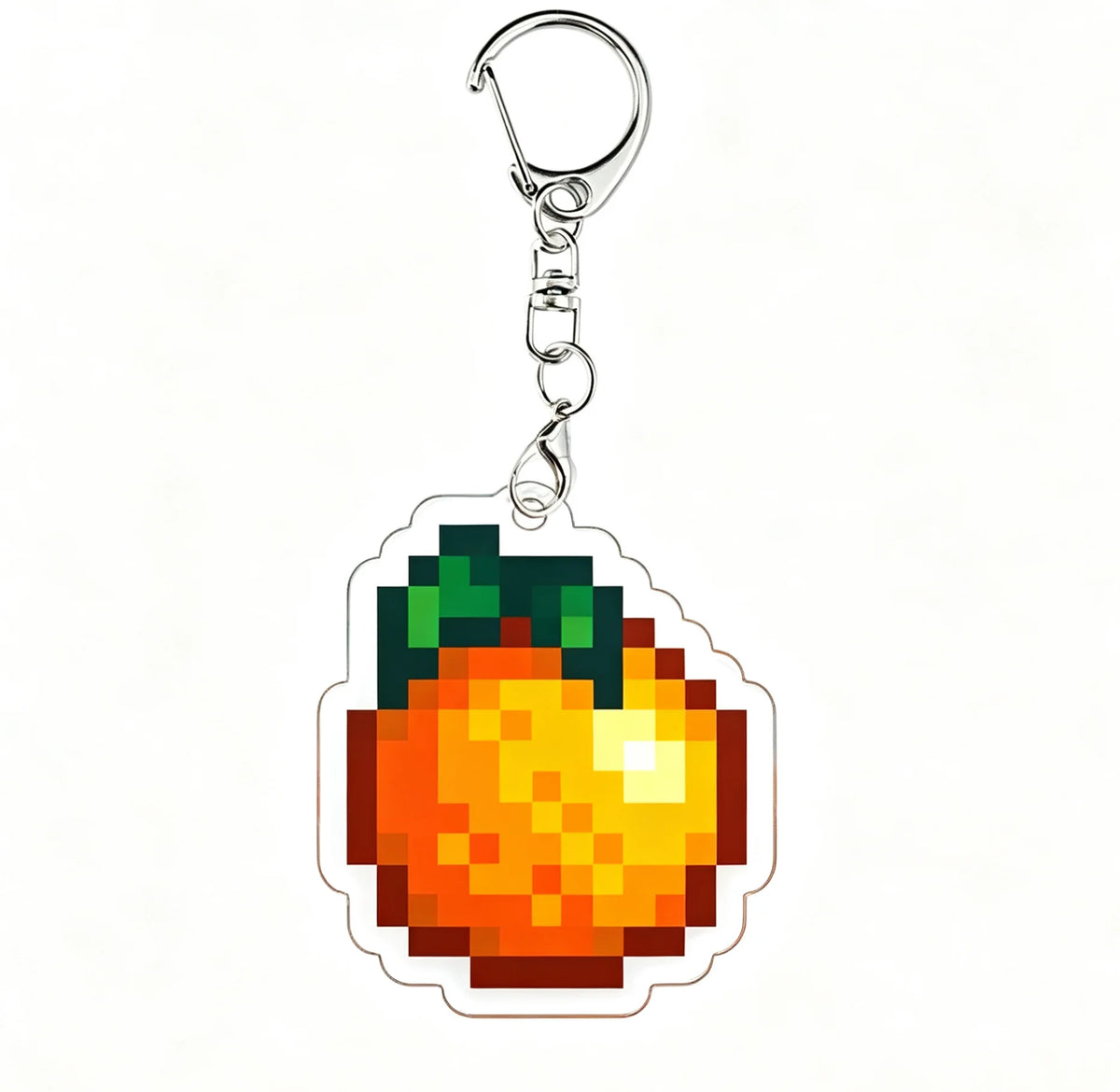 Acrylic keychain charm shaped like a bright orange fruit with green leaves