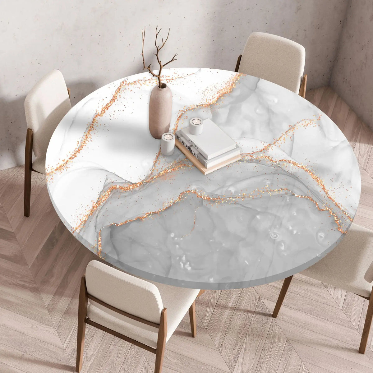 A round marble print tablecloth with an elastic edge is displayed on a wooden table in a bright room.