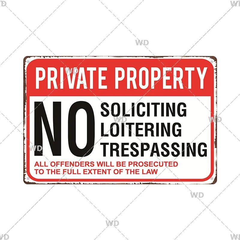 A vintage red and white warning sign with black text stating PRIVATE PROPERTY NO LOITERING TRESPASSING ALL OFFENDERS WILL BE 