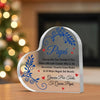A clear acrylic heart plaque engraved with a floral design and the message Gracias Por Tus Consejos Y Por Estar a Mi Lado Cua
