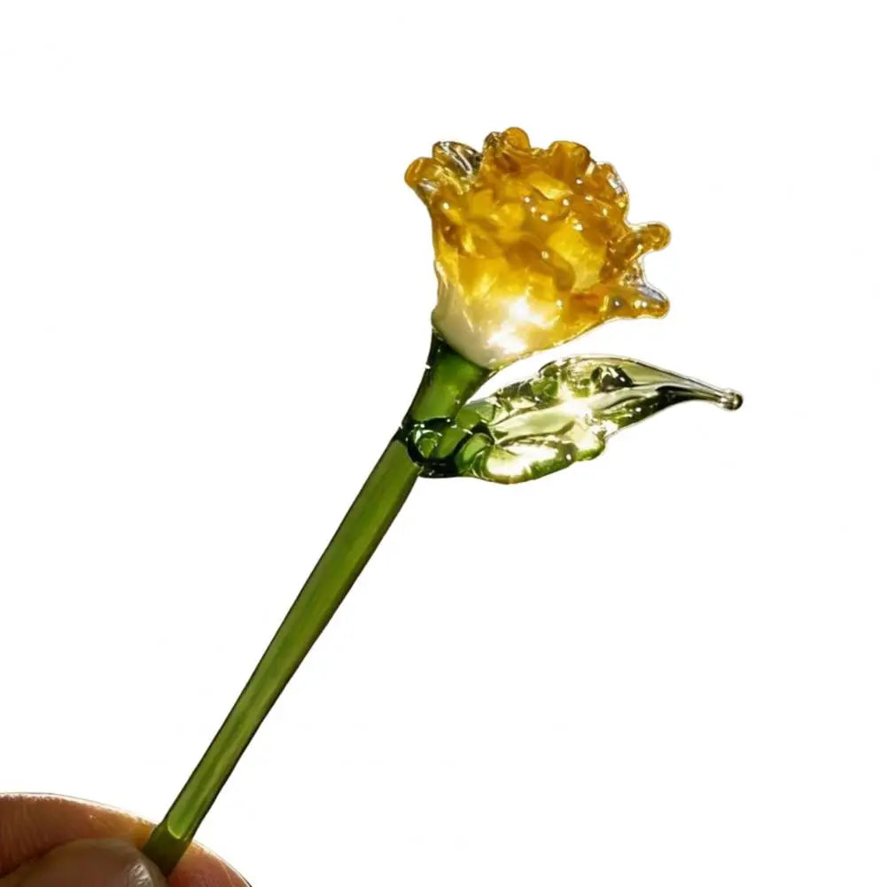 Handcrafted blue glass flower sculpture with a yellow bloom on a green stem