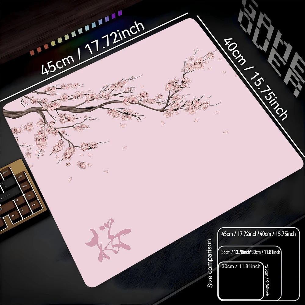 A pink cherry blossom themed non-slip gaming mouse pad with dimensions 45cm x 40cm.