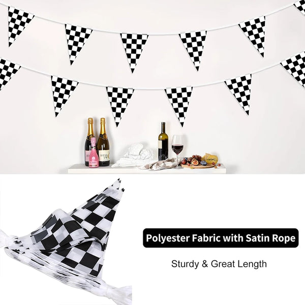 Black and white checkered pennant banner strung across a white wall, decorated with bottles and fruit.