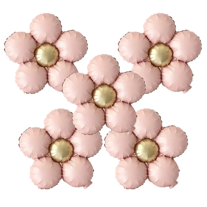 A set of five matte pink and gold foil flower balloons in a daisy design.