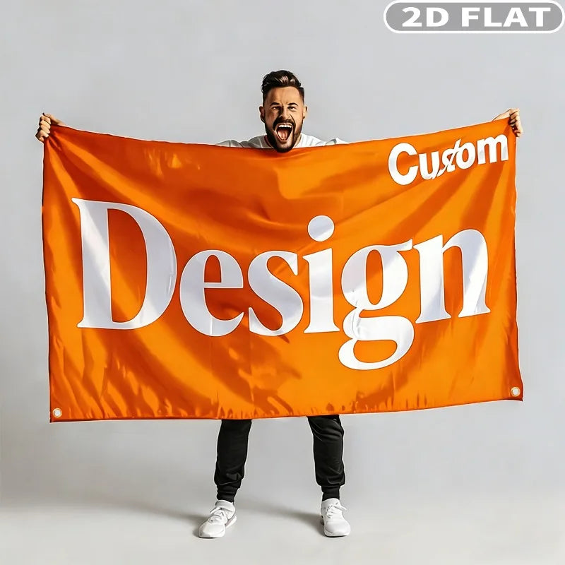A man holds up a large orange flag banner with the word Design printed on it.