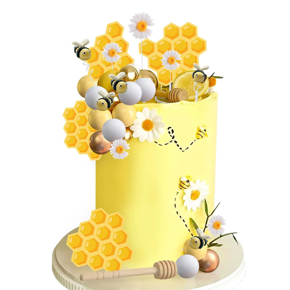 A yellow cake decorated with bee-themed elements including honeycomb shapes, bees, and a honey jar.
