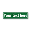 A rectangular green sign with the text Your text here on a white background.
