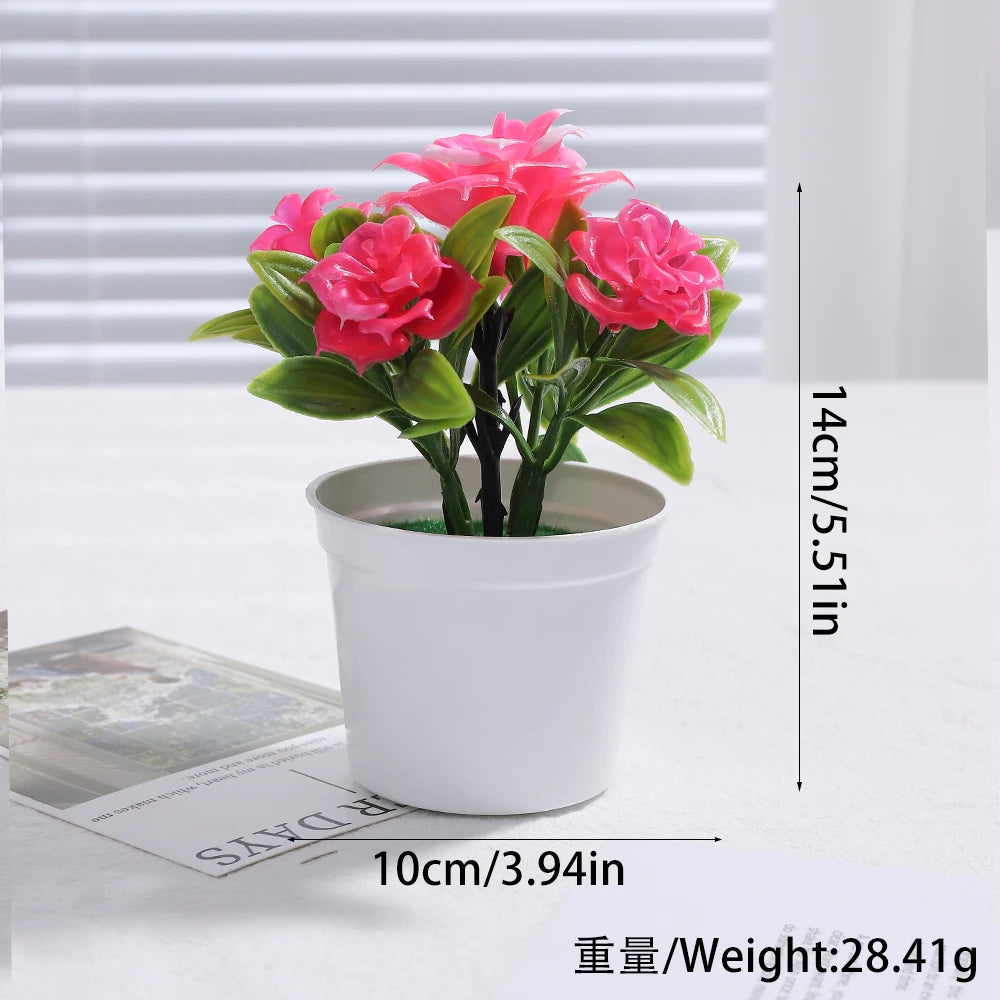 A potted artificial bonsai tree decoration with vibrant pink flowers set against a white background.