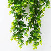Green artificial eucalyptus leaves hanging in a lush cascade for home decor