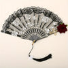 Vintage flamenco rose handheld folding fan with black and white floral patterns