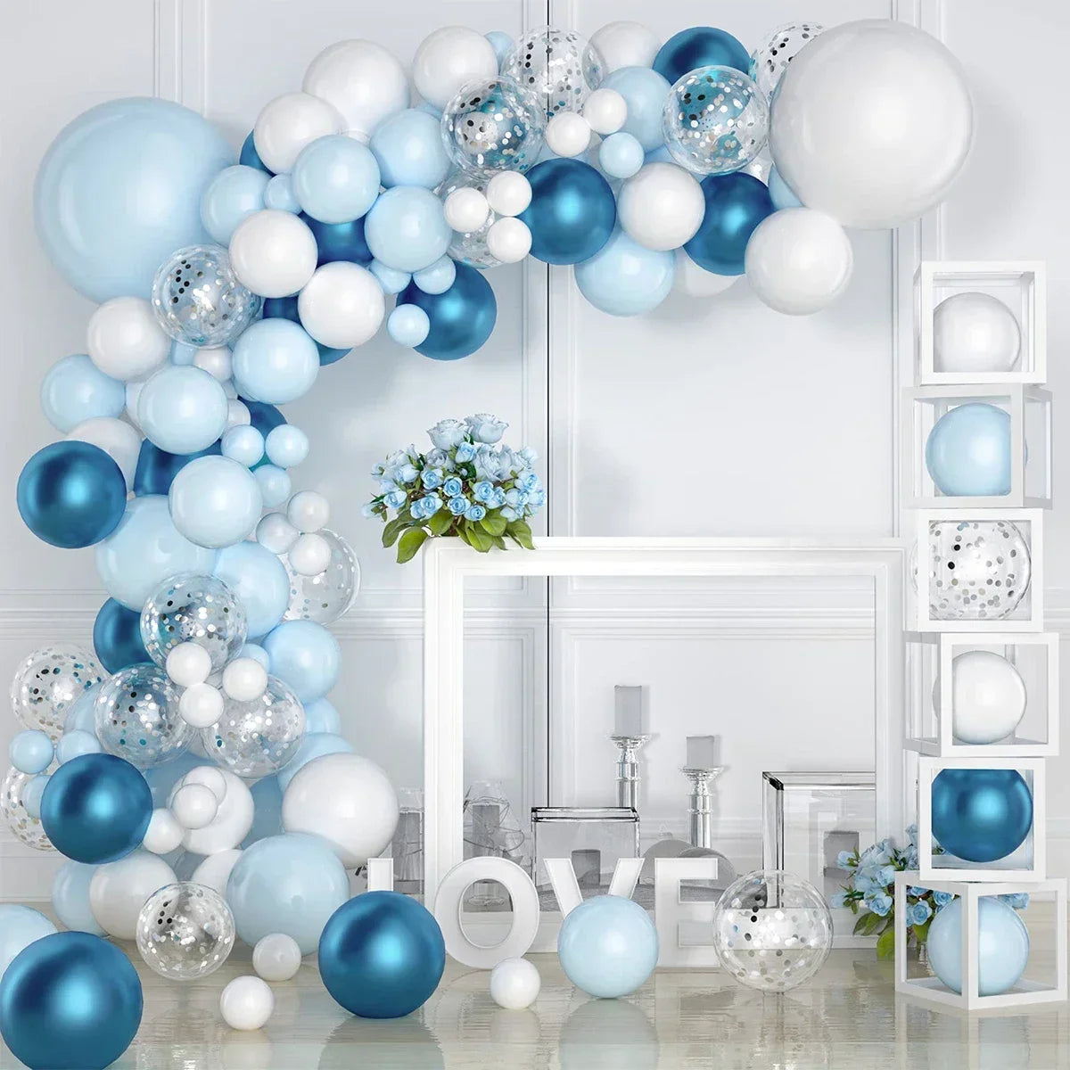 A white and blue balloon garland arch display featuring various sized balloons and a white frame.