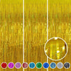 A set of metallic gold foil tinsel fringe backdrop strands and circular accents.
