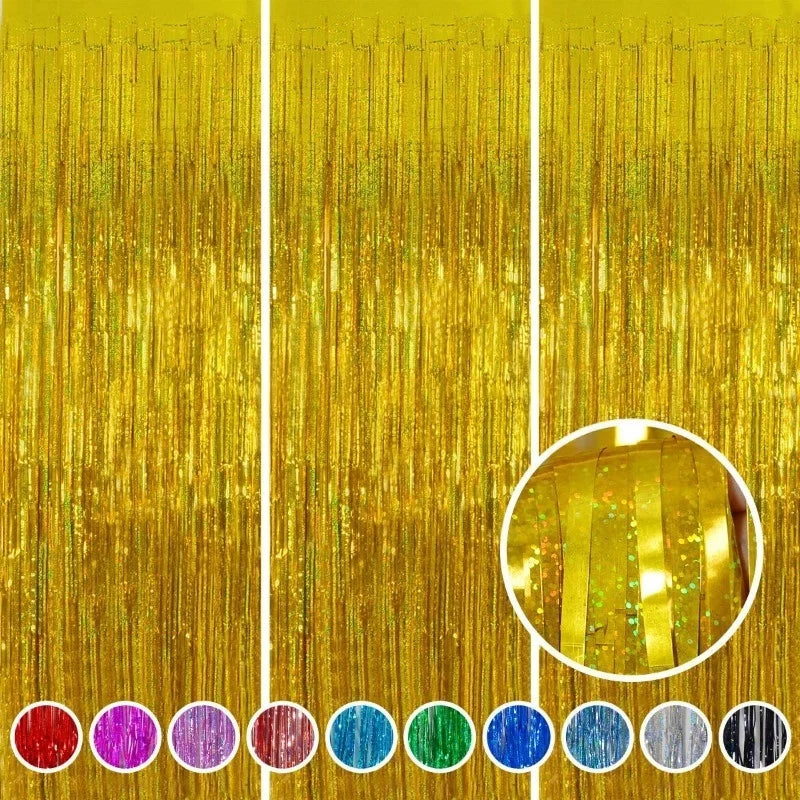A set of metallic gold foil tinsel fringe backdrop strands and circular accents.