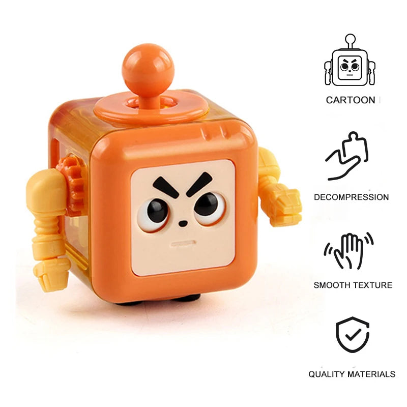 An orange fidget cube toy with a cartoon face and various sensory features.