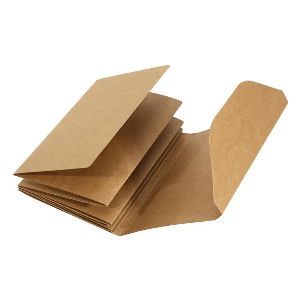 A stack of brown accordion folding photo albums.