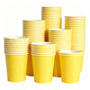 A stack of bright yellow disposable paper plates in various sizes and a variety pack.