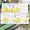 A set of inspirational star keychains featuring yellow and gold stars with text encouraging people to be a star and keep shin