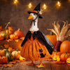 A decorative Halloween lawn goose costume featuring an orange body, black hat, and cape, surrounded by pumpkins and autumn le
