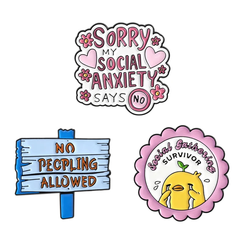Enamel pins featuring text like Sorry My Social Anxiety Says No and a yellow cartoon duck.