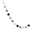 A garland of colorful felt balls in shades of white, teal, and gray.