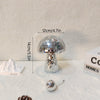 Silver mushroom-shaped disco ball decoration with a mirrored dome and pedestal stand