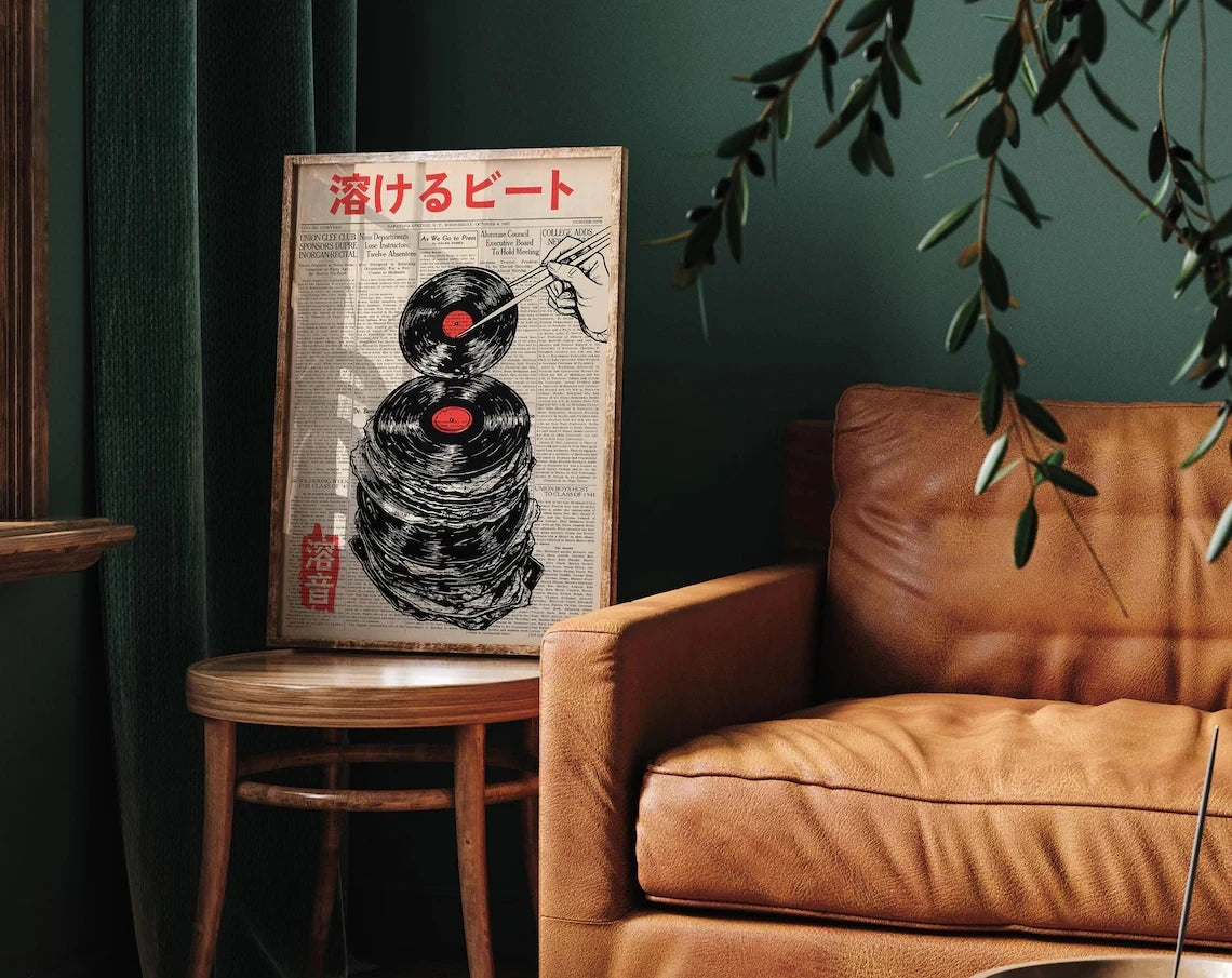 A vintage Japanese music poster featuring a record melting effect on canvas art displayed next to a leather armchair.