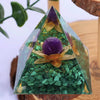 Handmade resin orgonite pyramid with natural green obsidian and gold copper coil crystals
