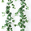 Green artificial ivy garland trailing down, used for home decor.