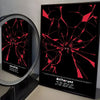 A framed poster featuring a cracked red silhouette of a figure against a black background for Deltarune
