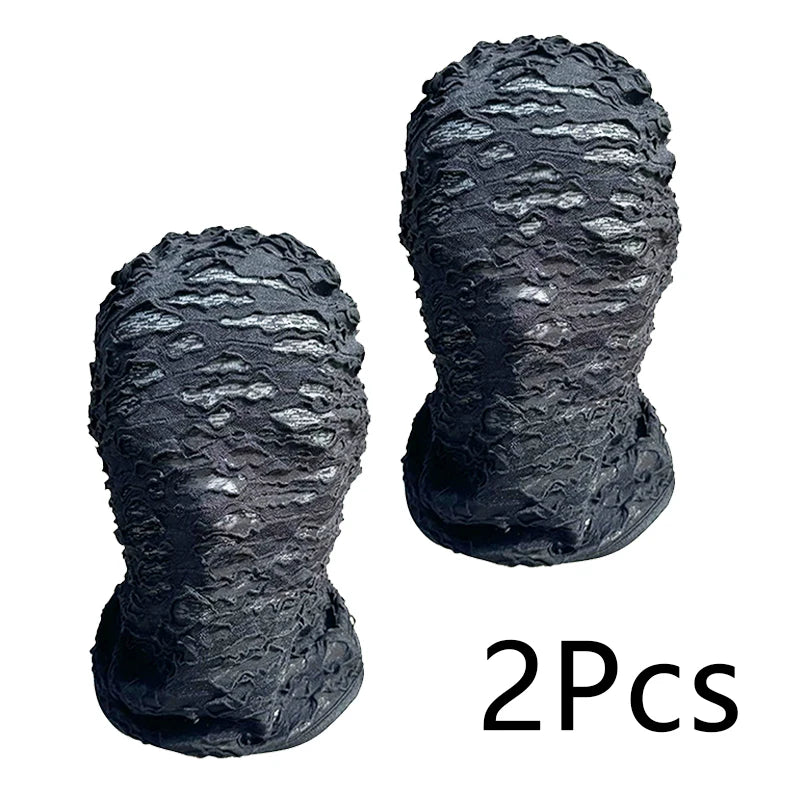 Two black mesh balaclava face masks shown from the front, textured and folded.