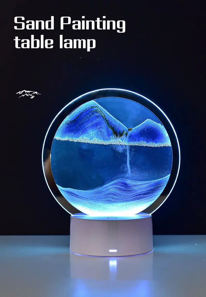 A sand painting table lamp featuring a glass globe with an underwater landscape of blue and purple colors.