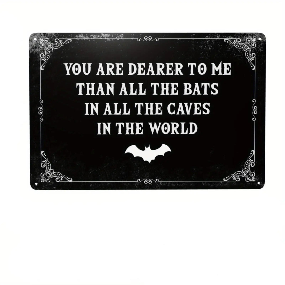 A black metal tin sign with white gothic text that reads You are dearer to me than all the bats in all the caves in the world