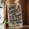 Vintage newspaper print art featuring the text What a Good Day to be proud of all the progress made on canvas wall art